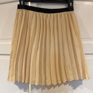Pale yellow pleated skirt
